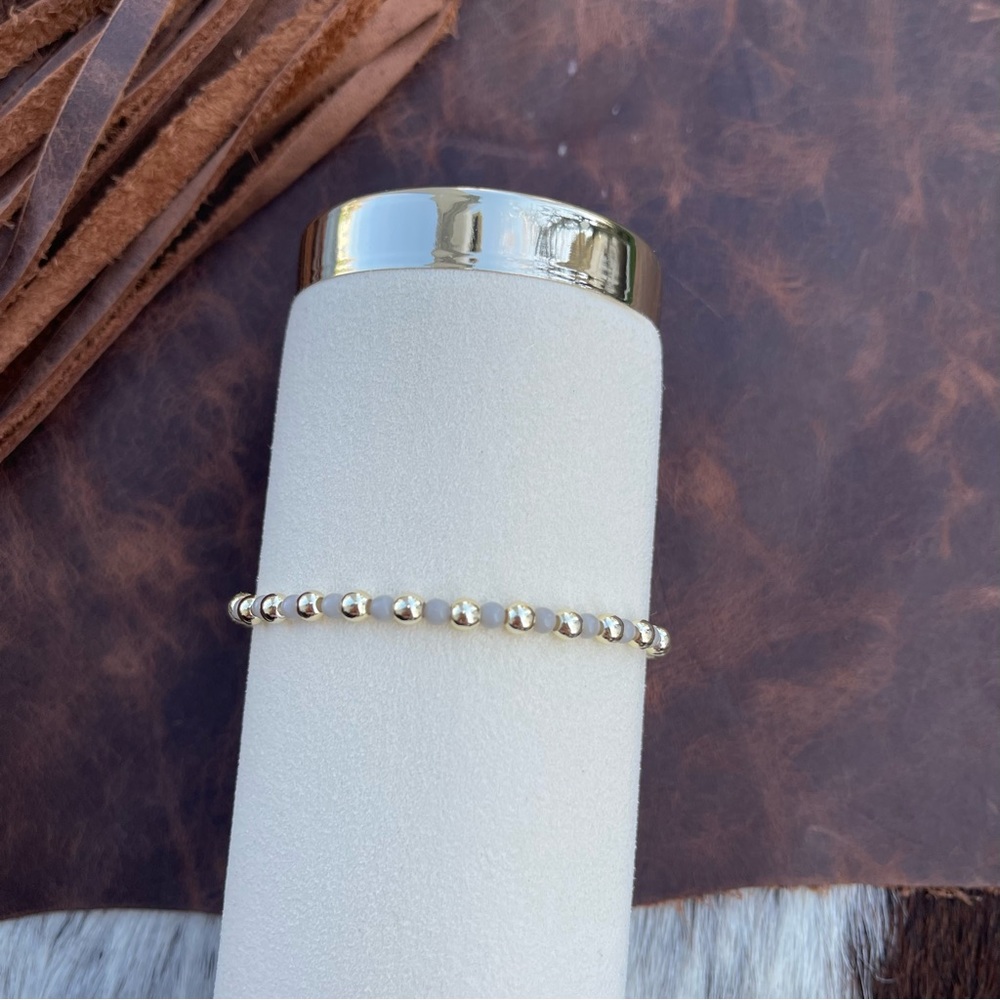 Gray and 14kt gold plated beaded bracelet